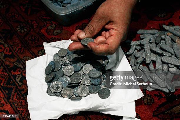 Detail of coins is shown as Osmund Bopearachchi, finds some coins from Mir Zakah treasure in an antique shop during The Quest for the treasure of...