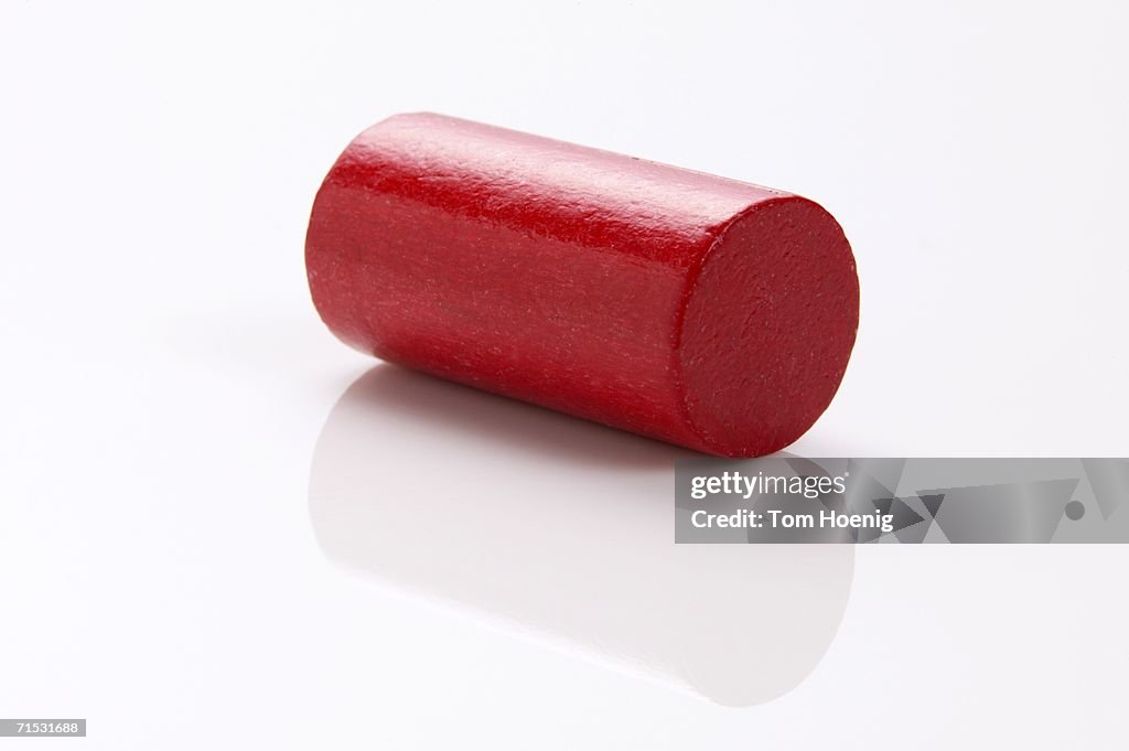 Red building block, cylinder, close-up