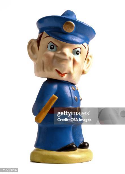 plastic figurine of a policeman - bobble head doll stock-fotos und bilder