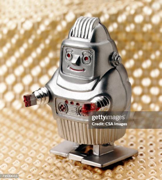 plastic toy robot - clockwork toy stock pictures, royalty-free photos & images