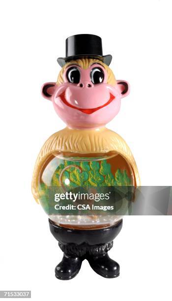 plastic snow globe monkey figurine - picture snow globe stock pictures, royalty-free photos & images
