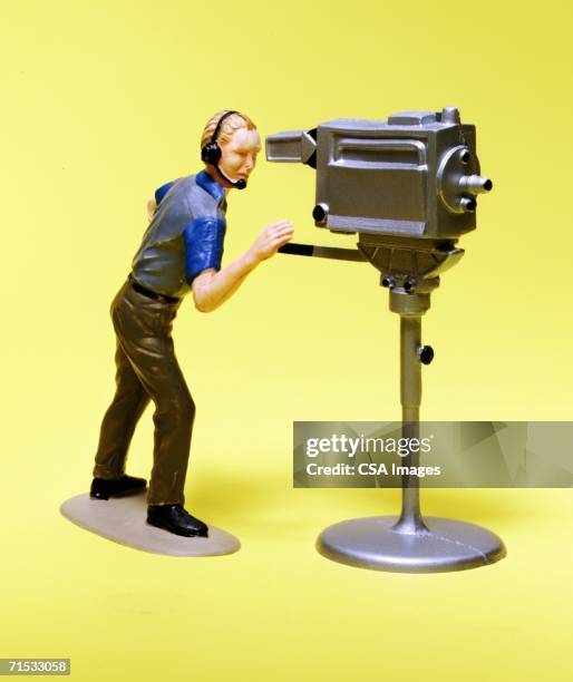 figurine of a cameraman - vinyl film stockfoto's en -beelden