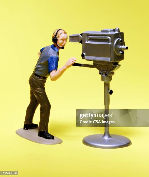 figurine of a cameraman - toy camera stock pictures, royalty-free photos & images