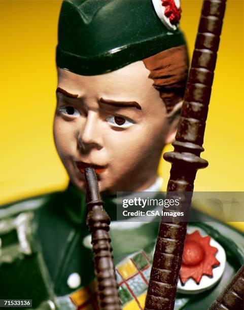 plastic figurine of a scottish bagpiper - piper stock pictures, royalty-free photos & images