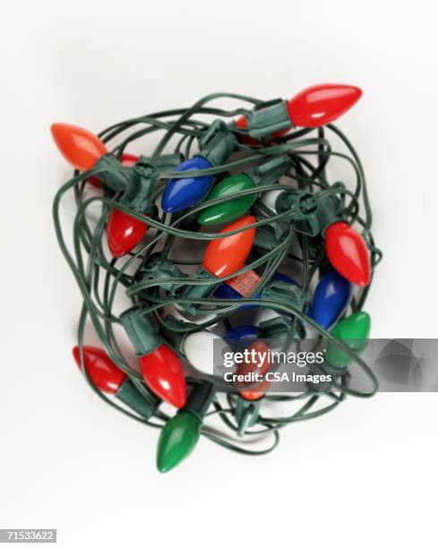 string of christmas lights - tangled christmas lights stock pictures, royalty-free photos & images