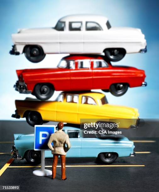 stacked cars in parking lot - toy cars photos et images de collection