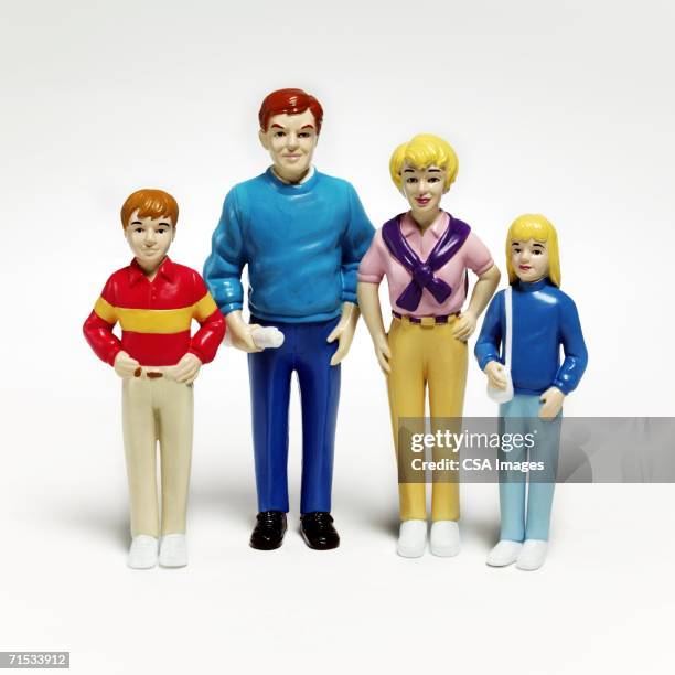 plastic figurines of a family - figurines stock-fotos und bilder