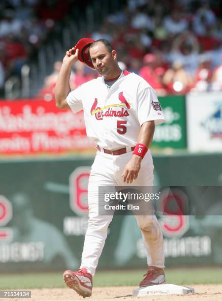 Albert Pujols of the St. Louis Cardinals walks off the field after being tagged out at secondbase during the game against the Los Angeles Dodgers on...