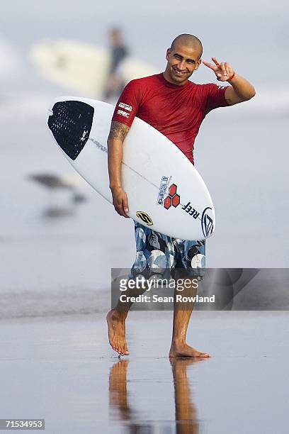 Current ASP world number four ranked surfer American Bobby Martinez waves at the Honda US Open of Surfing held by the Association of Surfing...