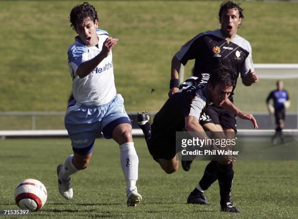 Rob Middleby of Sydney FC runs the ball forward as Sime Kovacevic of the Knights takes a tumble during the round three A-League pre-season match...