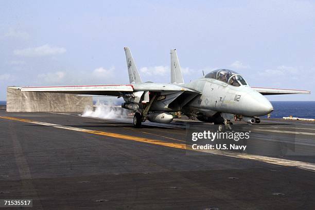 In this handout photo provided by the U.S. Navy, an F-14D Tomcat assigned to the "Tomcatters" of Fighter Squadron Three One , aircraft number 112,...