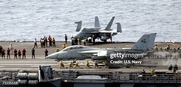 In this handout photo provided by the U.S. Navy, an F-14D Tomcat assigned to the "Tomcatters" of Fighter Squadron Three One , aircraft number 112,...