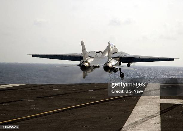 In this handout photo provided by the U.S. Navy, an F-14D Tomcat assigned to the "Tomcatters" of Fighter Squadron Three One , aircraft number 112,...