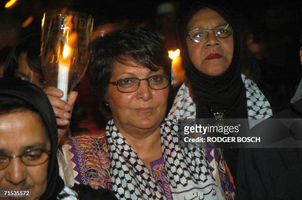 Cape Town, SOUTH AFRICA: Leila Khaled former aircraft hijacker with the Popular Front for the Liberation of Palestine, 28 July 2006 marches through...