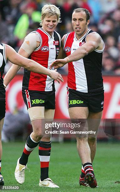 Fraser Gehrig is congratulated by Nick Riewoldt for St Kilda after kicking a goal during the round 17 AFL match between the St Kilda Saints and the...