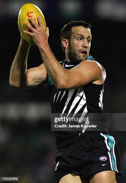 Darryl Wakelin of Port marks during the round 17 AFL match between the Port Adelaide Power and the Sydney Swans at AAMI Stadium on July 29, 2006 in...