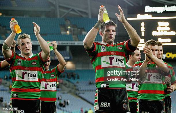 Rabbitohs players applaud their fans after winning the round 21 NRL match between the South Sydney Rabbitohs and the Canberra Raiders at Telstra...