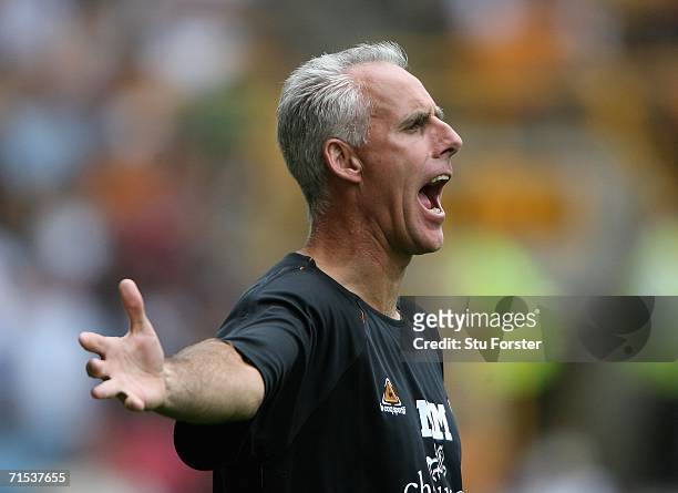 Wolves manager Mick McCarthy encourages his side from the sidelines prior to the Pre-season friendly match between Wolverhampton Wanderers and Aston...