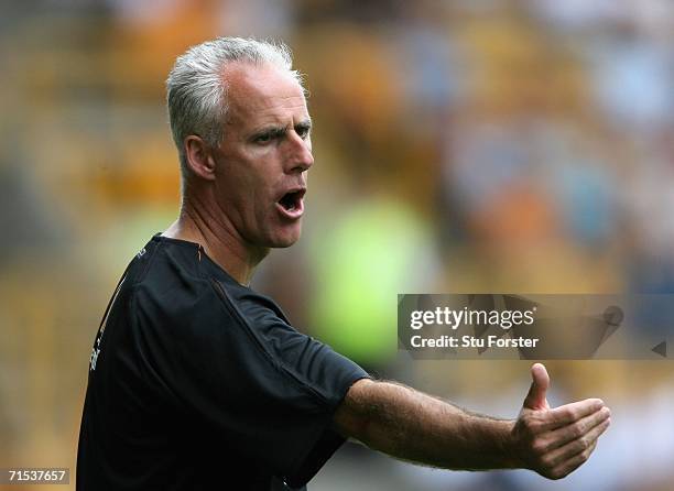 Wolves manager Mick McCarthy encourages his side from the sidelines prior to the Pre-season friendly match between Wolverhampton Wanderers and Aston...