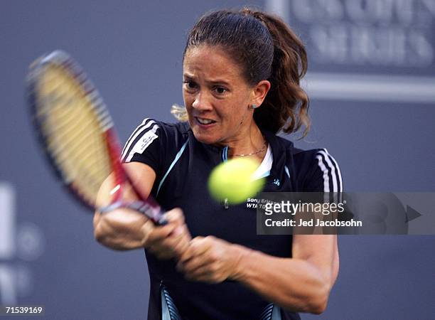 Patty Schnyder of Switzerland returns a shot against Tatiana Golovin of France during the Semifinals of the Bank of the West Classic tennis...