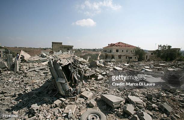 Destroyed buildings are seen after an Israeli air strike July 30, 2006 in Qana, Southern Lebanon. Approximately 56 civilians were killed, at least 34...
