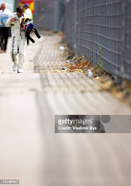 Jacques Villeneuve of Canada and BMW Sauber leaves the track after crashing out during the German Formula One Grand Prix at the Hockenheimring on...