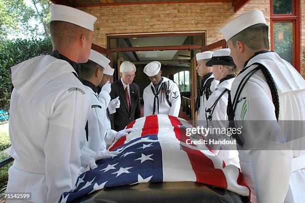 In this handout image released by the U.S. Navy, members of the Commander, Navy Region Mid-Atlantic Honor Guard carry the casket of retired Master...