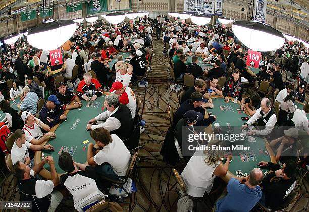 Players compete on the third day of the first round of the World Series of Poker no-limit Texas Hold 'em main event at the Rio Hotel & Casino July...