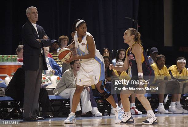 Head Coach Brian Winters of the Indiana Fever watches as Chelsea Newton of the Chicagio Sky gets defended by Tully Bevilaqua of the Indiana Fever on...