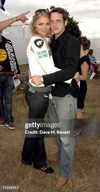 Model Jodie Kidd and Aiden Butler attend Smyle and Kidd offical players party during the Cartier Polo Day, at the Smyle Marquee in Great Windsor Park...