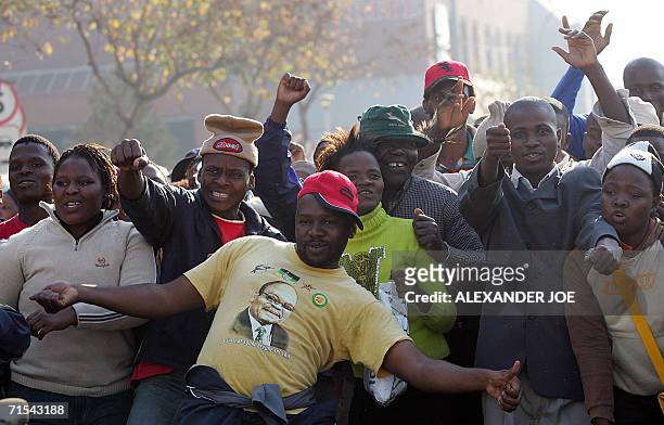Pietermaritzburg, SOUTH AFRICA: Surporters of South African former deputy President Jacob Zuma demonstrate outside the High Court premises during his...