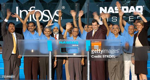 Founder and mentor of Infosys Technologies N.R.Narayana Murthy with NASDAQ President & CEO Bob Greifeld celebrate with Infosys officials during the...