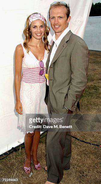 Matt Dawson and his partner attend Smyle and Kidd offical players party during the Cartier Polo Day, at the Smyle Marquee in Great Windsor Park on...