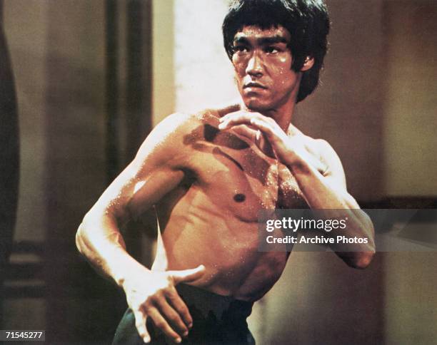 Chinese-American martial arts exponent Bruce Lee , in a karate stance, early 1970s.