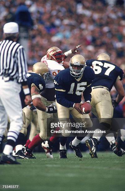 Quarterback Kevin McDougal of the University of Notre Dame Fighting Irish hands-off the ball against the Florida State University Seminoles during...
