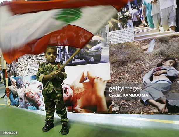Boy waves a Lebanese flag during a protest 31 July 2006 in Abidjan during a demonstration of Lebanese expatriots protesting against the Israeli...
