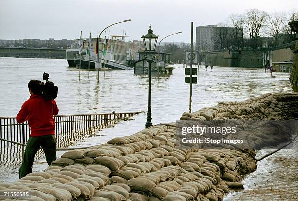 flooded river in city - sandbag stock pictures, royalty-free photos & images