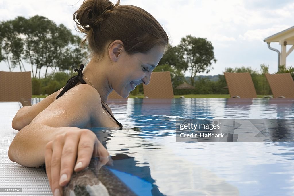 A woman relaxing in a swimming pool