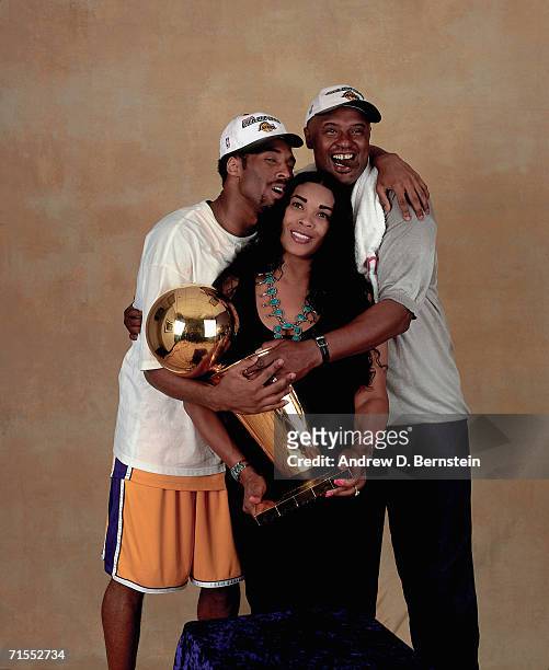 Kobe Bryant of the Los Angeles Lakers poses for a photo with his parents after winning the NBA Championship on June 19, 2000 at the Staples Center in...