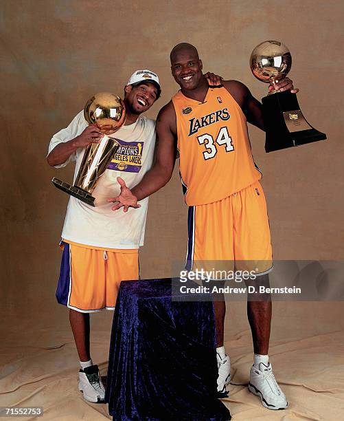 Shaquille O'Neal and Kobe Bryant of the Los Angeles Lakers pose for a photo after winning the NBA Championship on June 19, 2000 at the Staples Center...