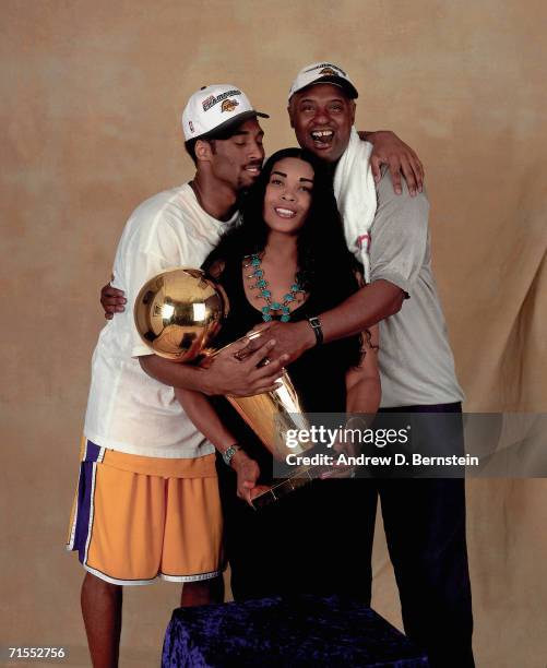 Kobe Bryant of the Los Angeles Lakers poses for a photo with his parents after winning the NBA Championship on June 19, 2000 at the Staples Center in...