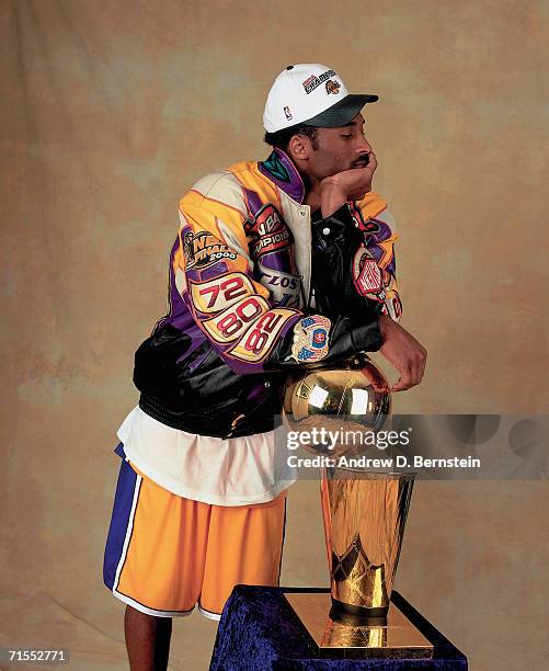 Kobe Bryant of the Los Angeles Lakers poses for a photo after winning the NBA Championship on June 19, 2000 at the Staples Center in Los Angeles,...