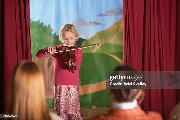 young girl playing violin at recital - kids talent show stock pictures, royalty-free photos & images