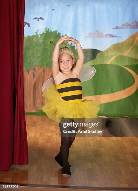 young girl in bee costume on stage - child actress stock pictures, royalty-free photos & images