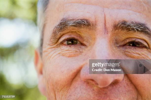 close up senior hispanic man - expressive eyes bildbanksfoton och bilder