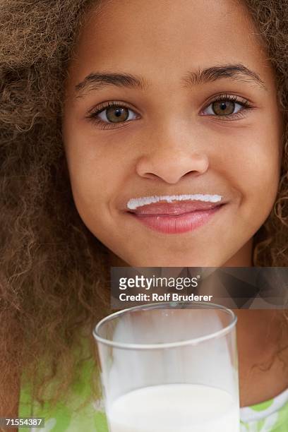 close up of african american girl with milk mustache - animal whisker stock pictures, royalty-free photos & images