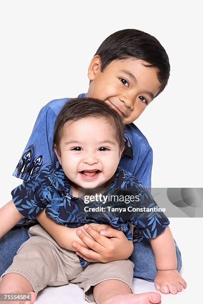 Small Brother Brother Holding Little Brother Photos and Premium High Res Pictures ...