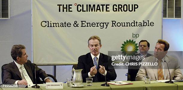 Long Beach, UNITED STATES: British Prime Minister Tony Blair gestures as California Governor Arnold Schwarzenegger and BP Chairman Lord John Browne...