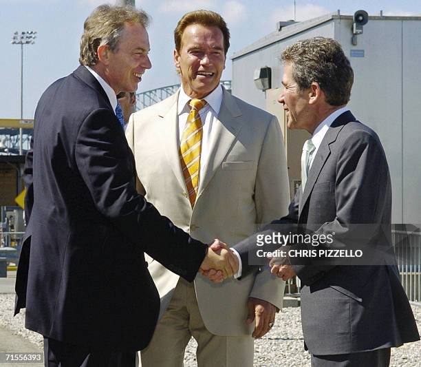 Long Beach, UNITED STATES: British Prime Minister Tony Blair is greeted by Governor Arnold Schwarzenegger and BP Chairman Lord John Browne prior to a...