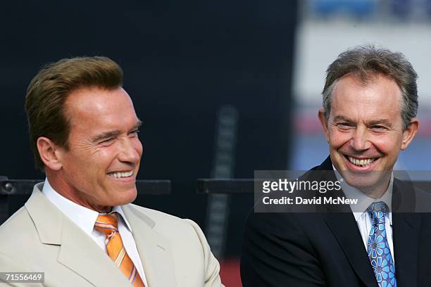 California Gov. Arnold Schwarzenegger and British Prime Minister Tony Blair talk at a news conference at the Port of Long Beach July 31, 2006 in Long...